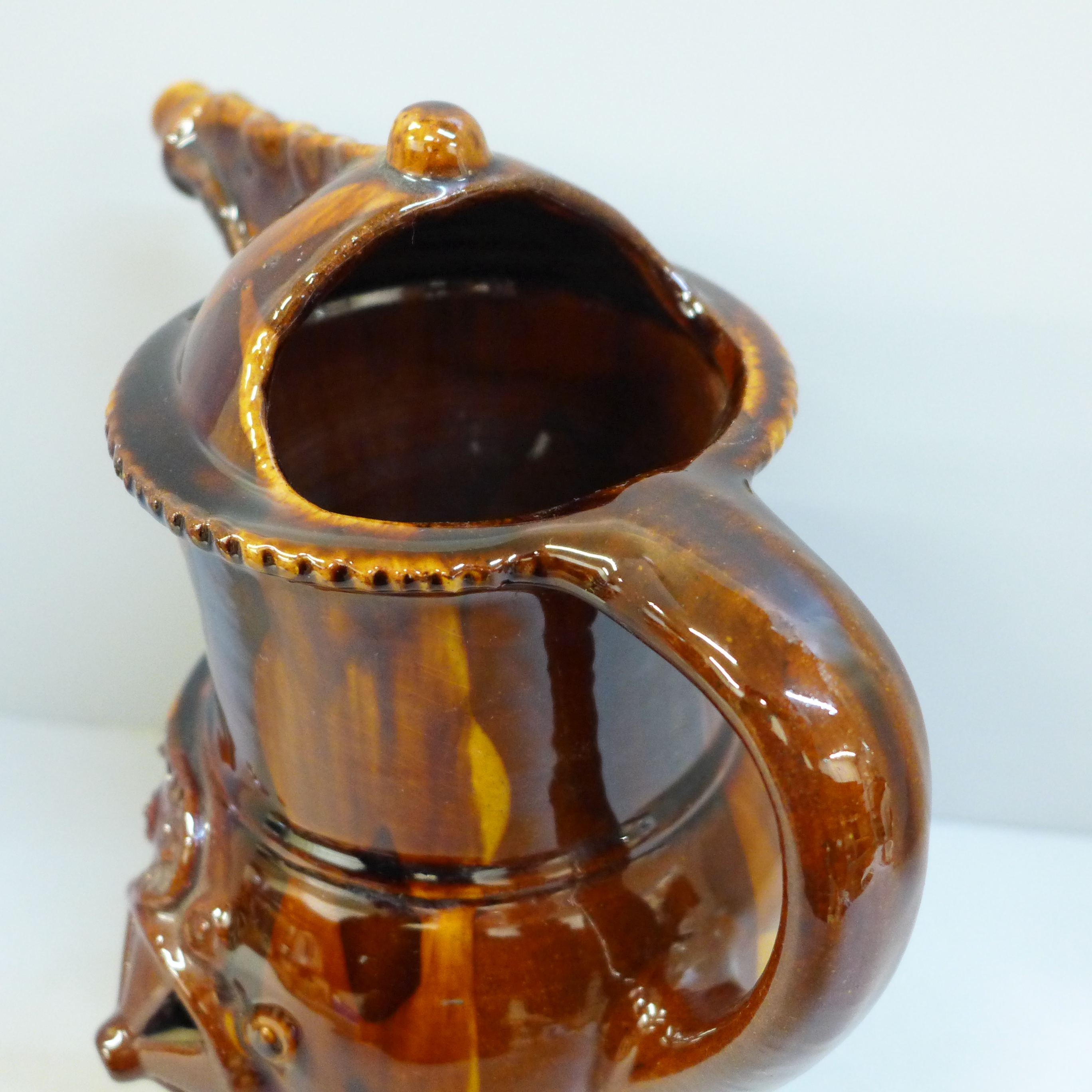 A treacle glaze pottery puzzle jug, 26cm - Image 5 of 6