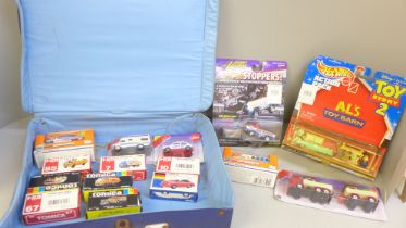 A collection of model vehicles, all boxed including a Toy Story 2 Al's Toy Barn Hot Wheels set,