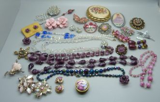 A collection of costume jewellery and a compact, etc.