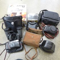 A pair of Swift binoculars, 8 x 40, boxed, a Nikon EM 35mm SLR film camera, flash, one other Nikon