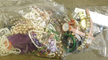 A collection of wristwatches, vintage brooches and earrings and a collection of bead necklaces