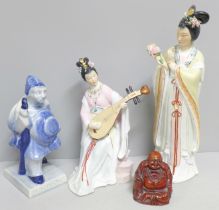 A Delft figure, two oriental figures and a Buddha figure
