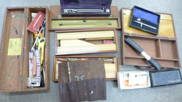 A collection of fine drawing instruments; a 19th Century brass rolling rule, Elliott Bros., 30