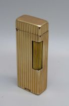 A 14ct gold cased Dunhill lighter, marked 'Outer Jacket 14K Gold'