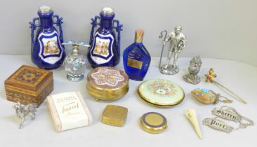 A pair of silver rimmed vases, a silver filled model chicken, compacts and scent bottles