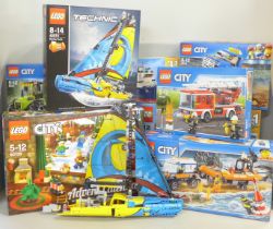 Nine Lego sets; five City including 4 x 4 Response Unit and Heavy Cargo Transport, Technic Racing