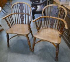 A pair of 19th Century elm and yew Windsor chairs