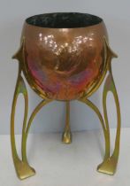 An Art Nouveau Jugendstil copper and brass planter, c1910, of rocket form with pierced open