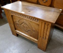 A small 17th Century style carved oak coffer