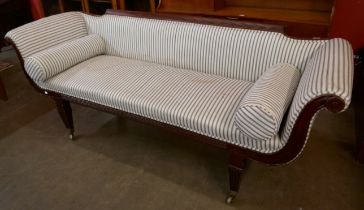 A Regency mahogany and upholstered scroll arm settee