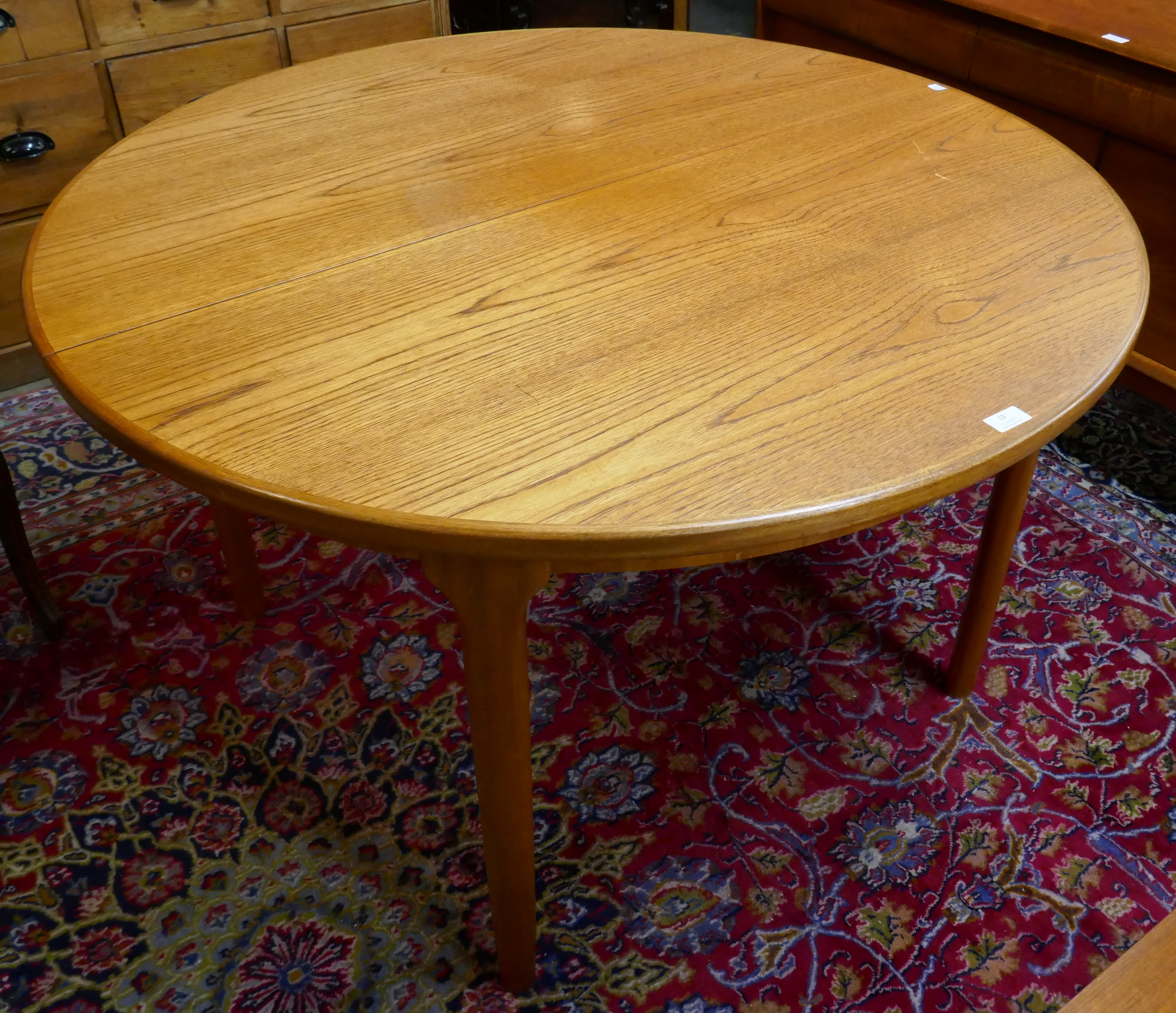 A McIntosh teak circular extending table