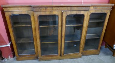 A Victorian walnut breakfront four door bookcase