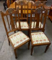 A set of four Arts and Crafts oak dining chairs