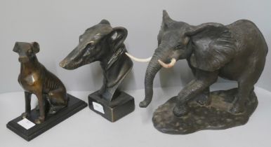A large resin sculpture of an African elephant, a bronze sculpture of a seated h ound and a bronze