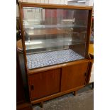 A teak display cabinet