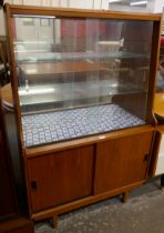 A teak display cabinet