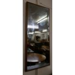 A teak framed mirror