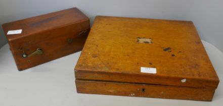 A wooden case of plated cutlery and an electric shock machine