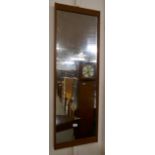 A teak framed mirror