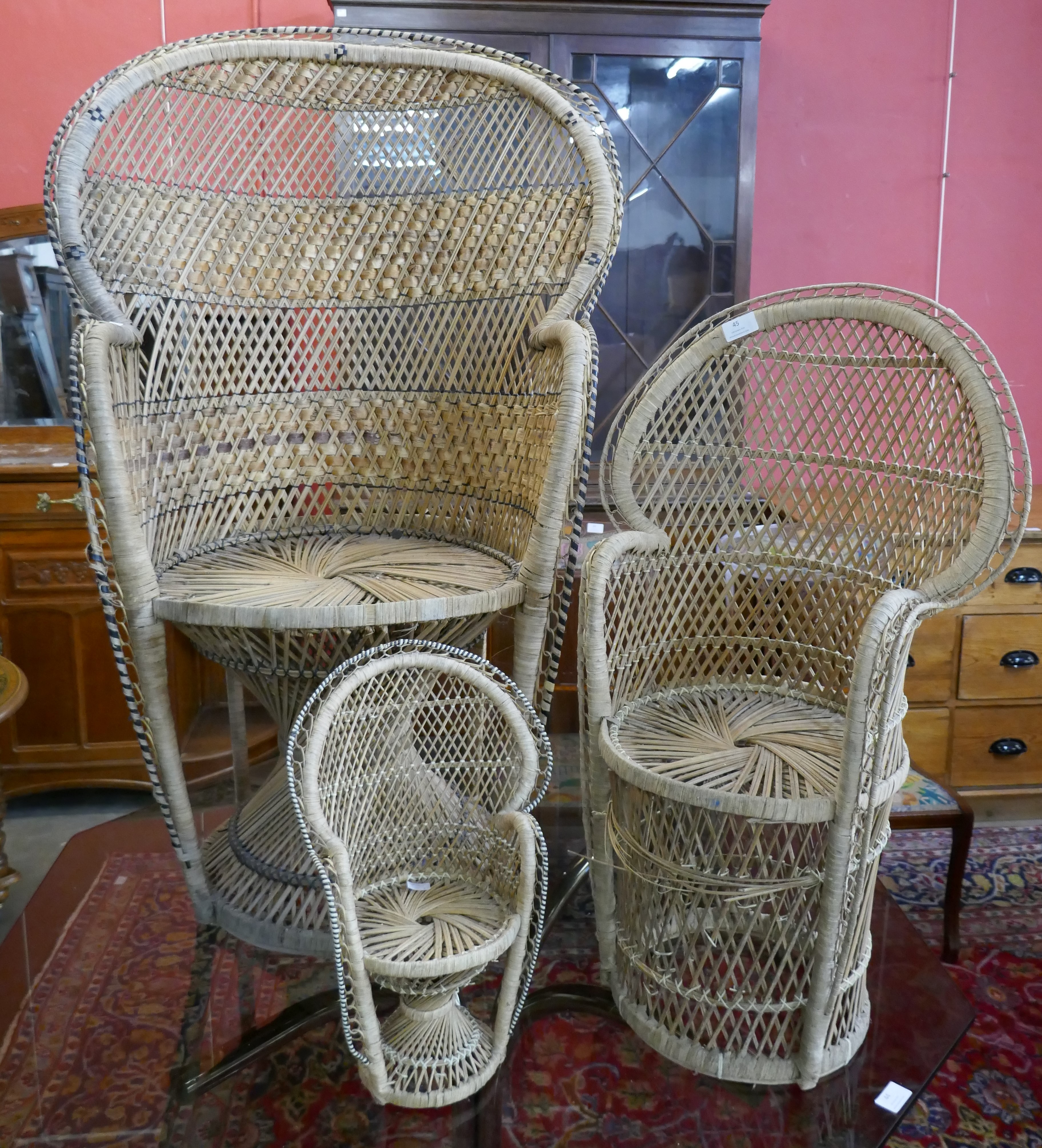 A set of three Italian graduated wicker peacock chairs