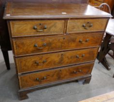 A George III inlaid mahogany chest of drawers
