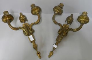 A pair of brass wall sconces