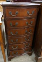 A mahogany serpentine chest of drawers