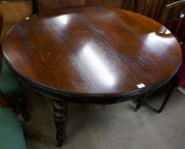 A Victorian mahogany extending dining table