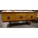 A teak six drawer sideboard