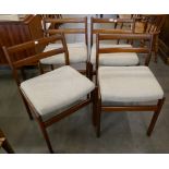 A set of four teak dining chairs