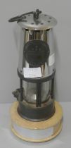 An Eccles Type 6 miners safety lamp with presentation stand to Sir Gordon Hobday, 1985