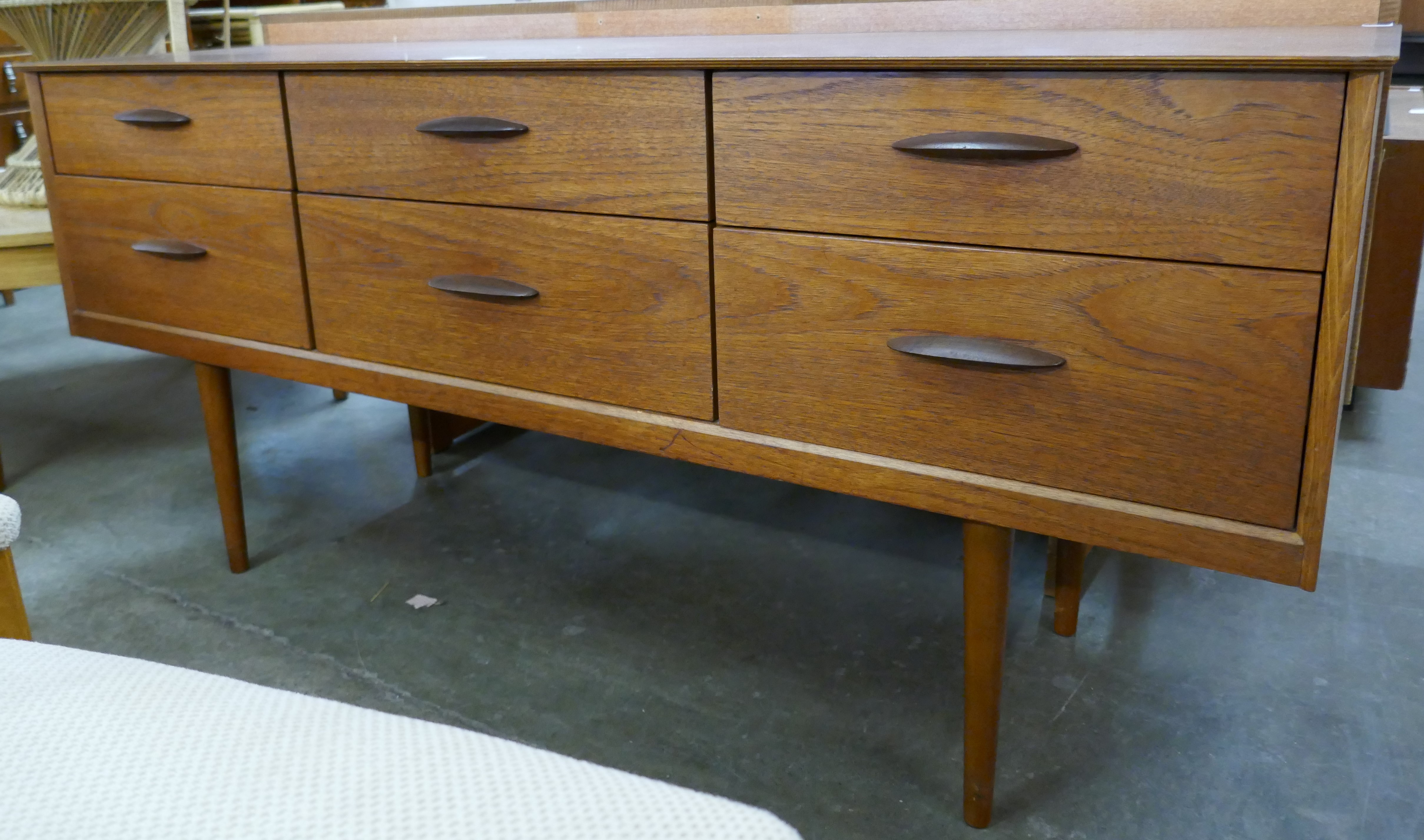 A teak six drawer sideboard