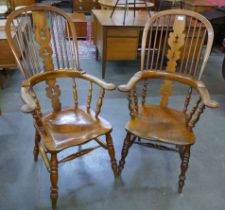 A pair of 19th Century elm and beech Windsor highback armchairs