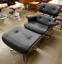 A Charles & Ray Eames style black leather and simulated rosewood revolving lounge chair and ottoman