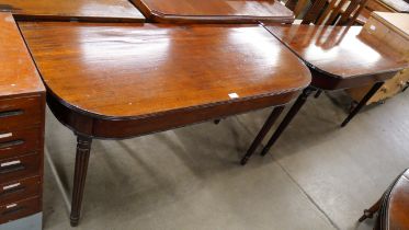 A pair of Regency mahogany console tables