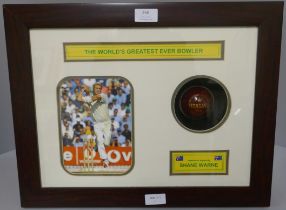 A framed cricket display, photograph and signed Morgan's cricket ball by Shane Warne, 'The World's