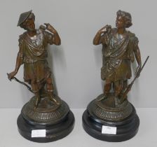 A pair of painted spelter figures, hunters