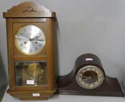 A German wooden cased wall clock and a mantel clock