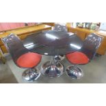 A French Agier Cuivre circular glass and chrome tulip dining table and three chairs