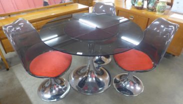 A French Agier Cuivre circular glass and chrome tulip dining table and three chairs