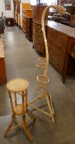 A bamboo snake shaped plant stand and one other