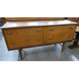 A teak four drawer sideboard