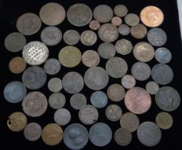 A collection of assorted old bronze coins and tokens