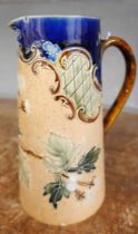 A Royal Doulton Slaters floral design Lambeth stoneware jug, 17cm, small chip to the spout