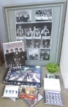 A collection of The Beatles memorabilia including CDs (11), book, jigsaw puzzle, a glass apple and a