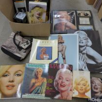 A box of Marilyn Monroe memorabilia including prints, calendars, books, etc.