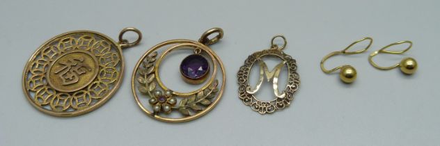 A 14k gold Chinese pendant, 3.9g, (marked on outer rim), two other pendants and a pair of earrings