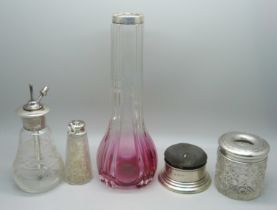 A silver rimmed glass vase, a silver topped atomiser, silver pin cushion/jewellery box, a silver