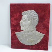 A mounted tin plate profile portrait of Joseph Staliln