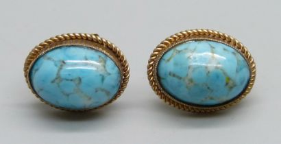 A pair of 9ct gold and cabochon stone screw back earrings